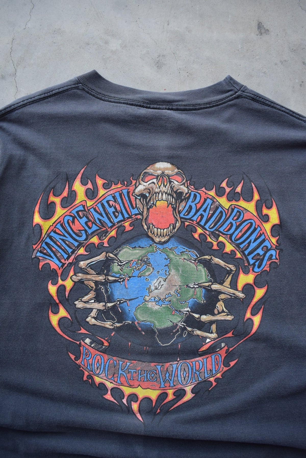 Bad Bones 'Rock The World' Faded-Black Graphic Tee — 1990s (XXL) - Retrospective Store