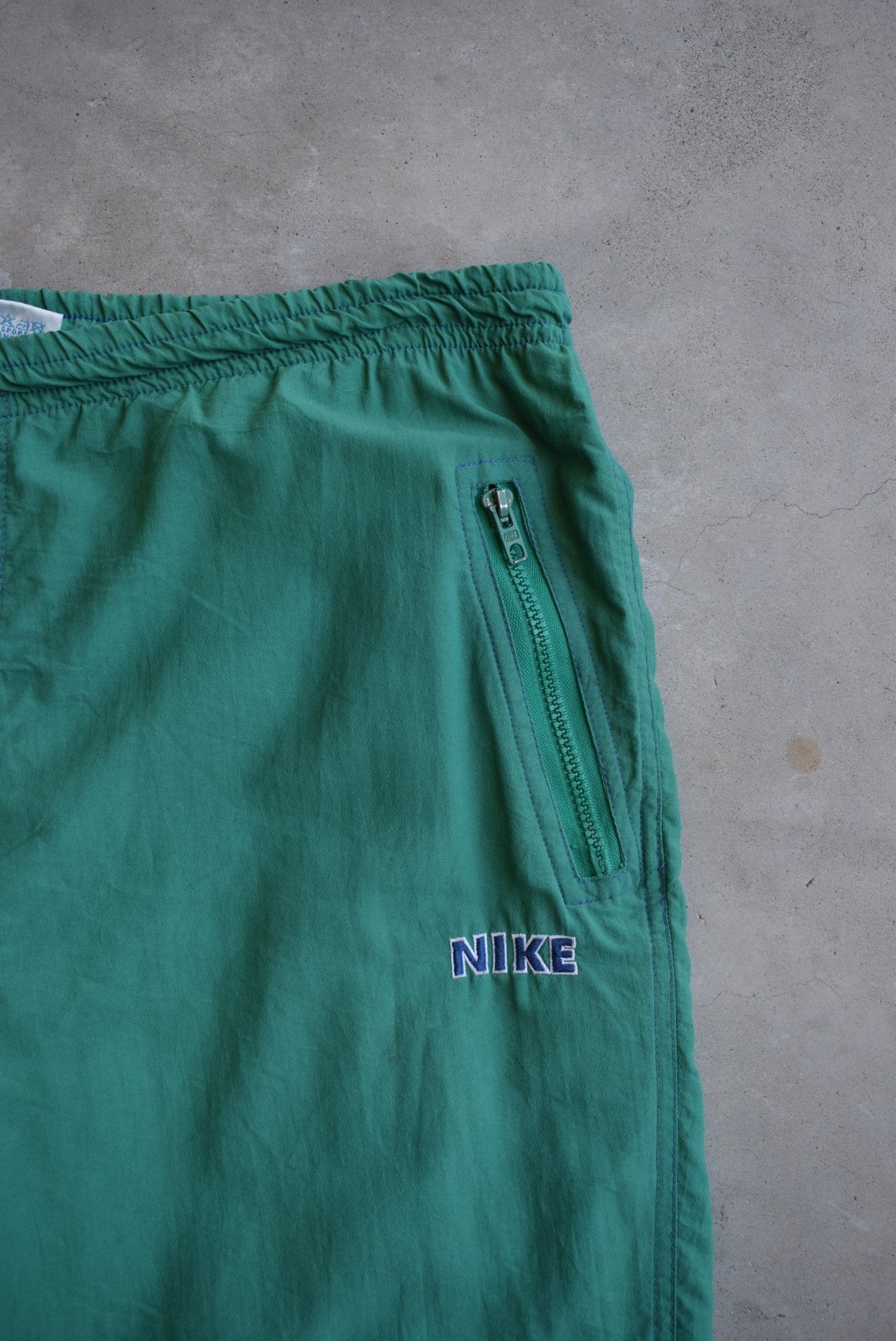 Nike Green Embroidered Spellout Track Pants — 1990s (M) - Retrospective Store
