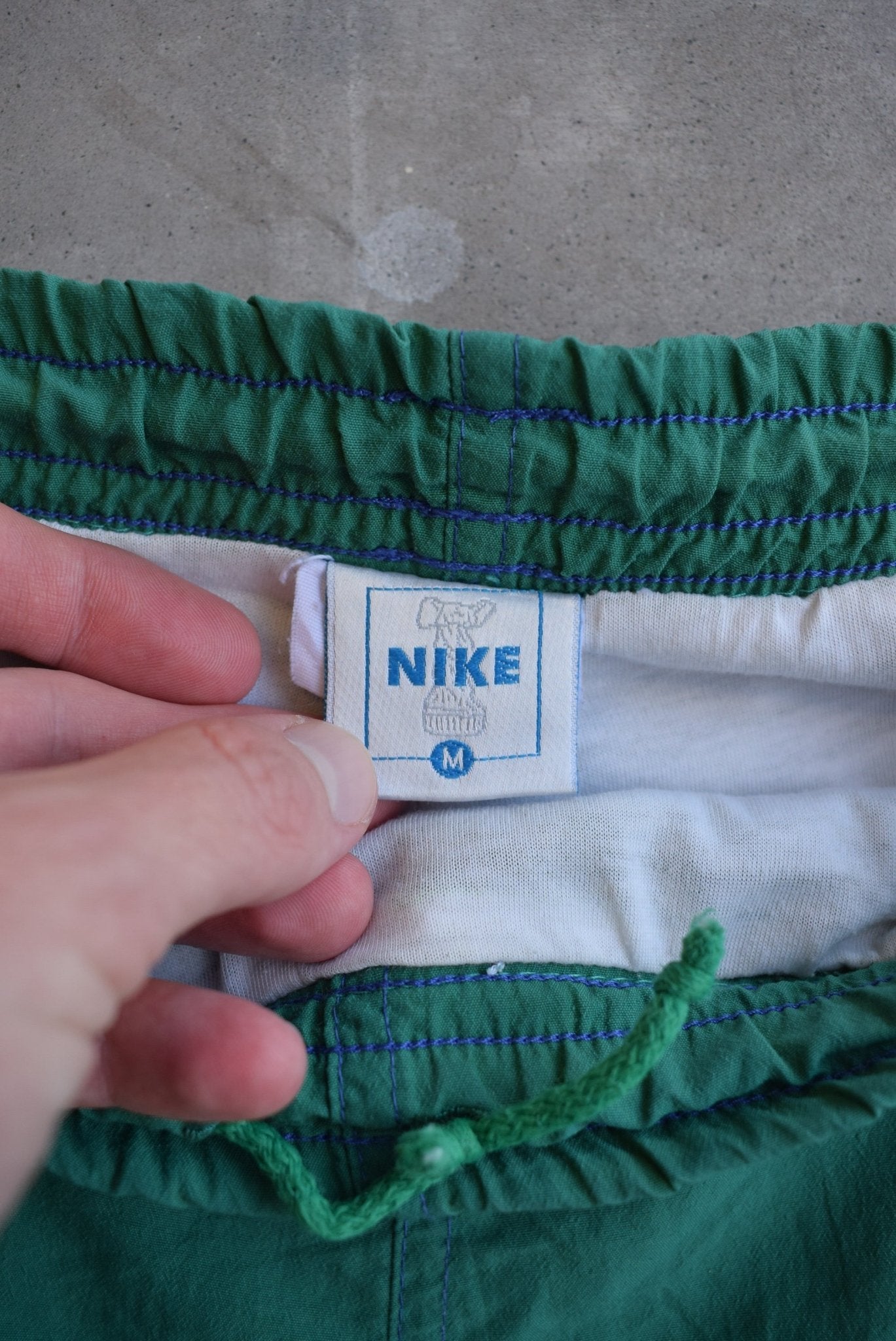 Nike Green Embroidered Spellout Track Pants — 1990s (M) - Retrospective Store