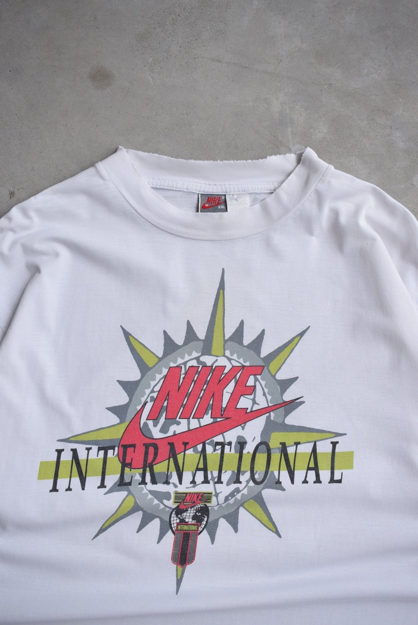 Nike International White Graphic Tee — 1990s (XL) - Retrospective Store