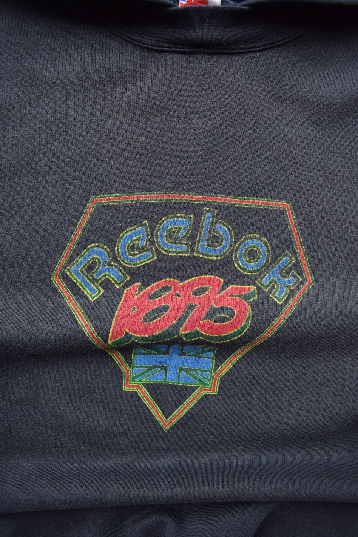 Reebok Faded-Black Spellout Hoodie — 1990s (M/L) - Retrospective Store