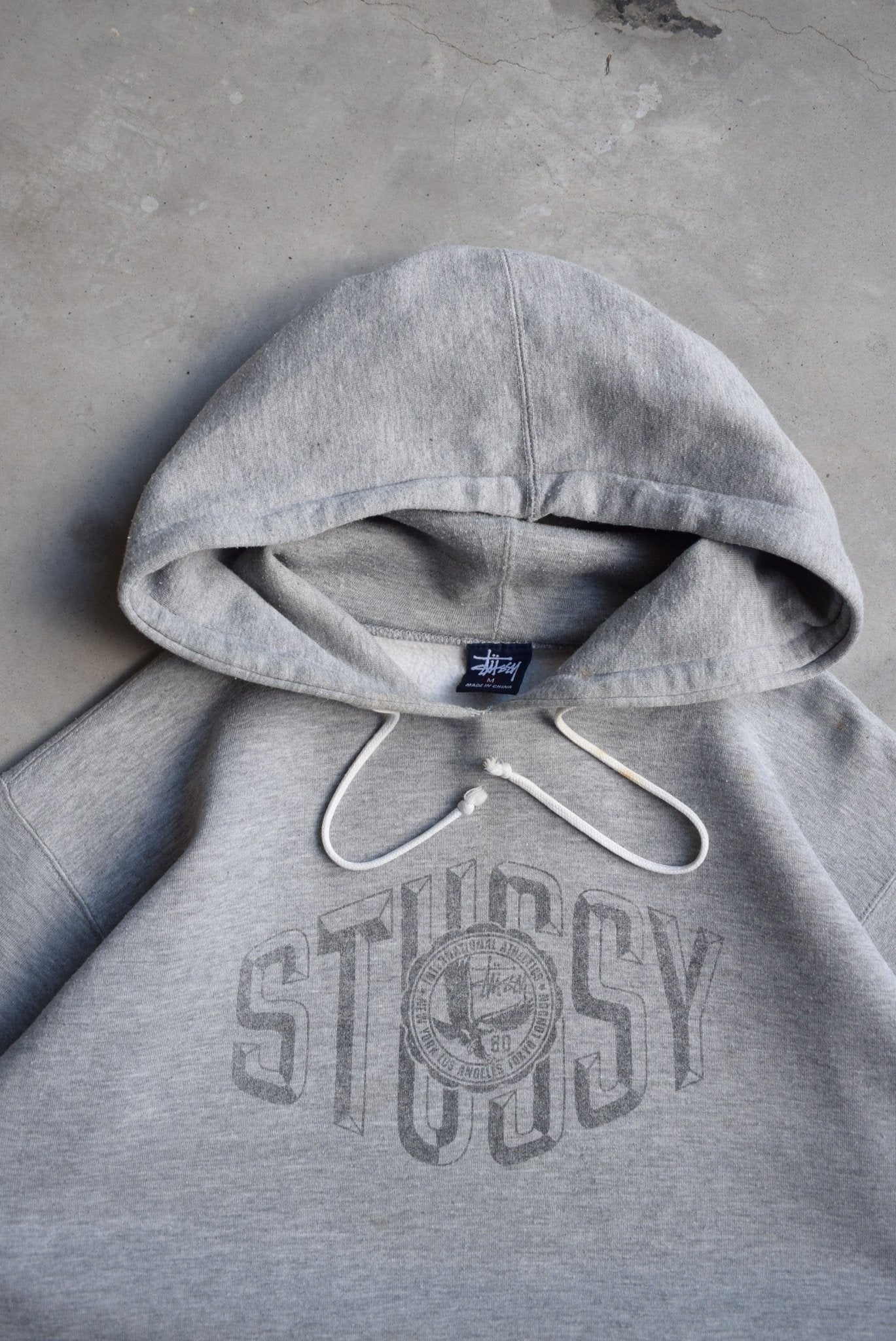 Stussy Grey Spellout Hoodie — 2000s (M/L) - Retrospective Store
