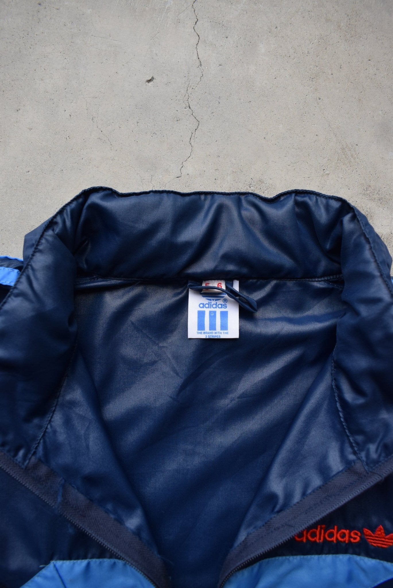 Adidas Navy Embroidered Spellout Spray Jacket — 1980s (L/XL) - Retrospective Store