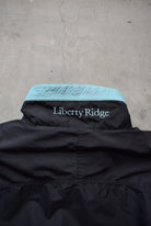 Columbia Black & Baby-Blue Embroidered Spellout Jacket — 1990s (M) - Retrospective Store