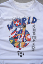 Football World Champion White Graphic Tee — 1990s (M) - Retrospective Store