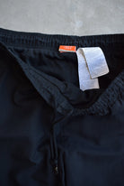Nike Black Embroidered Swoosh Track Pants — 2000s (M) - Retrospective Store