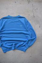 Nike Blue Embroidered Swoosh Crewneck — 2000s (XXL) - Retrospective Store