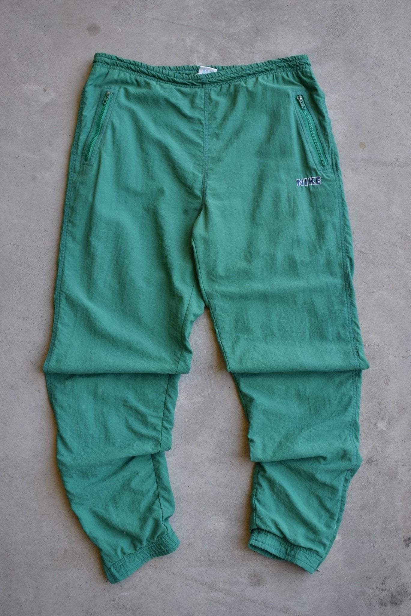 Nike Green Embroidered Spellout Track Pants — 1990s (M) - Retrospective Store