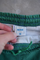 Nike Green Embroidered Spellout Track Pants — 1990s (M) - Retrospective Store