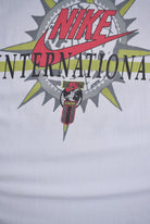 Nike International White Graphic Tee — 1990s (XL) - Retrospective Store
