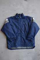 Nike Navy Embroidered Swoosh Heavyweight Jacket — 1990s (L/XL) - Retrospective Store