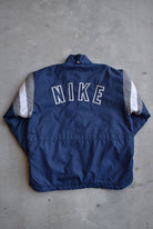 Nike Navy Embroidered Swoosh Heavyweight Jacket — 1990s (L/XL) - Retrospective Store