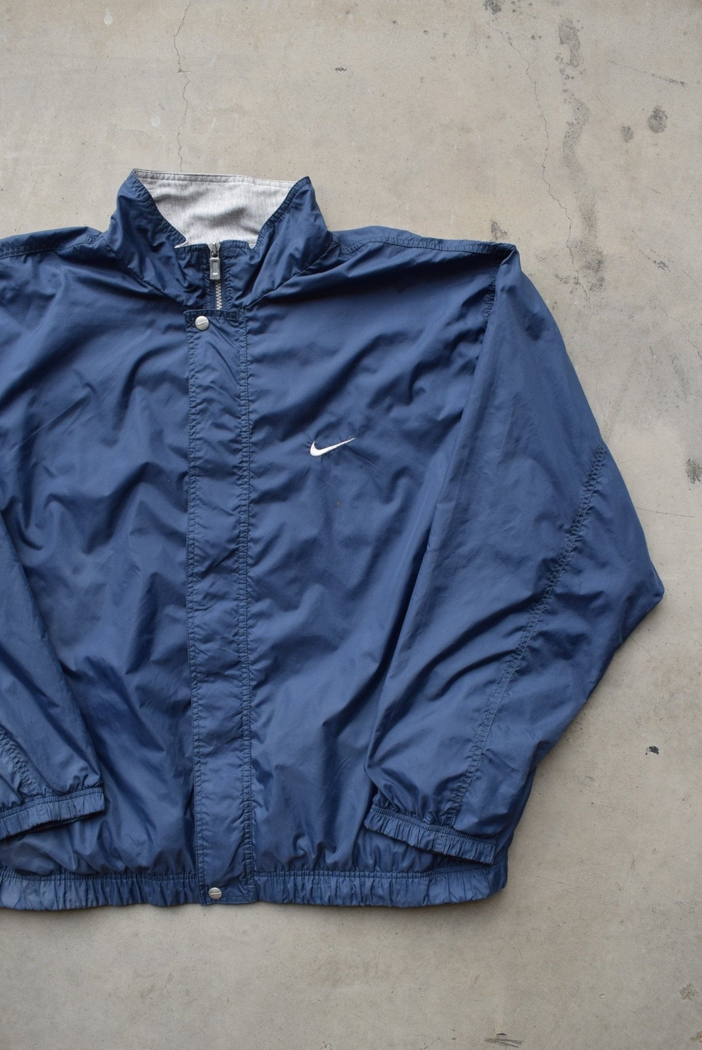 Nike Navy Embroidered Swoosh Jacket — 1990s (XL/XXL) - Retrospective Store