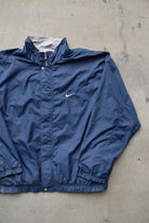 Nike Navy Embroidered Swoosh Jacket — 1990s (XL/XXL) - Retrospective Store