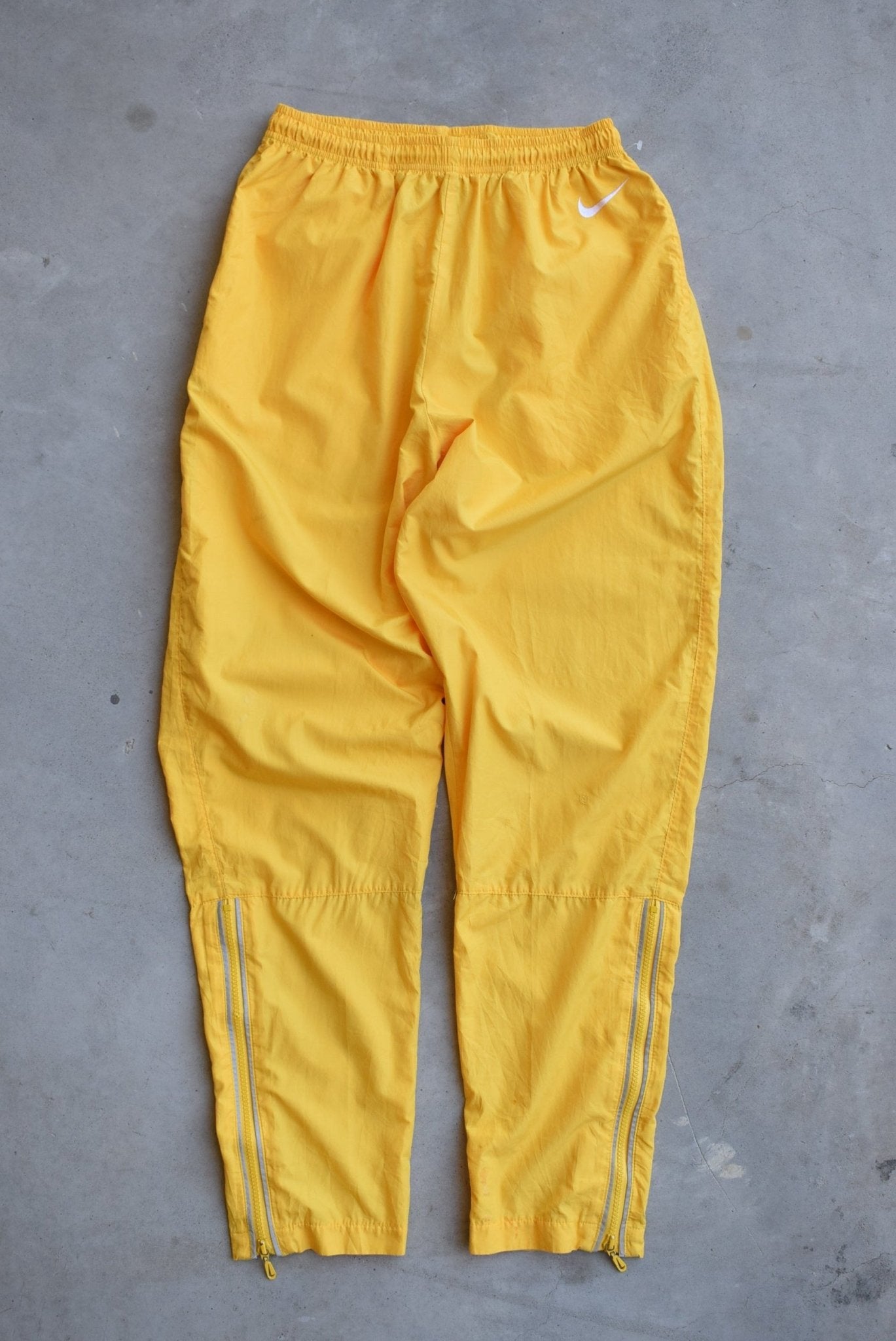 Nike Yellow Embroidered Swoosh Track Pants — 1990s (XS) - Retrospective Store