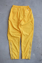 Nike Yellow Embroidered Swoosh Track Pants — 1990s (XS) - Retrospective Store