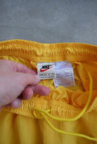 Nike Yellow Embroidered Swoosh Track Pants — 1990s (XS) - Retrospective Store