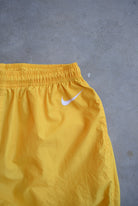 Nike Yellow Embroidered Swoosh Track Pants — 1990s (XS) - Retrospective Store