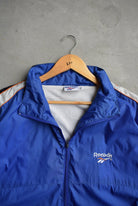 Reebok Classic Logo Embroidered Windbreaker Jacket — 1990s (XL) - Retrospective Store
