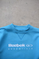 Reebok Essentials Blue Embroidered Spellout Crewneck — 2000s (S/M) - Retrospective Store