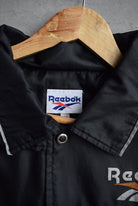 Reebok Spellout Windbreaker Jacket — 1990s (XL/XXL) - Retrospective Store