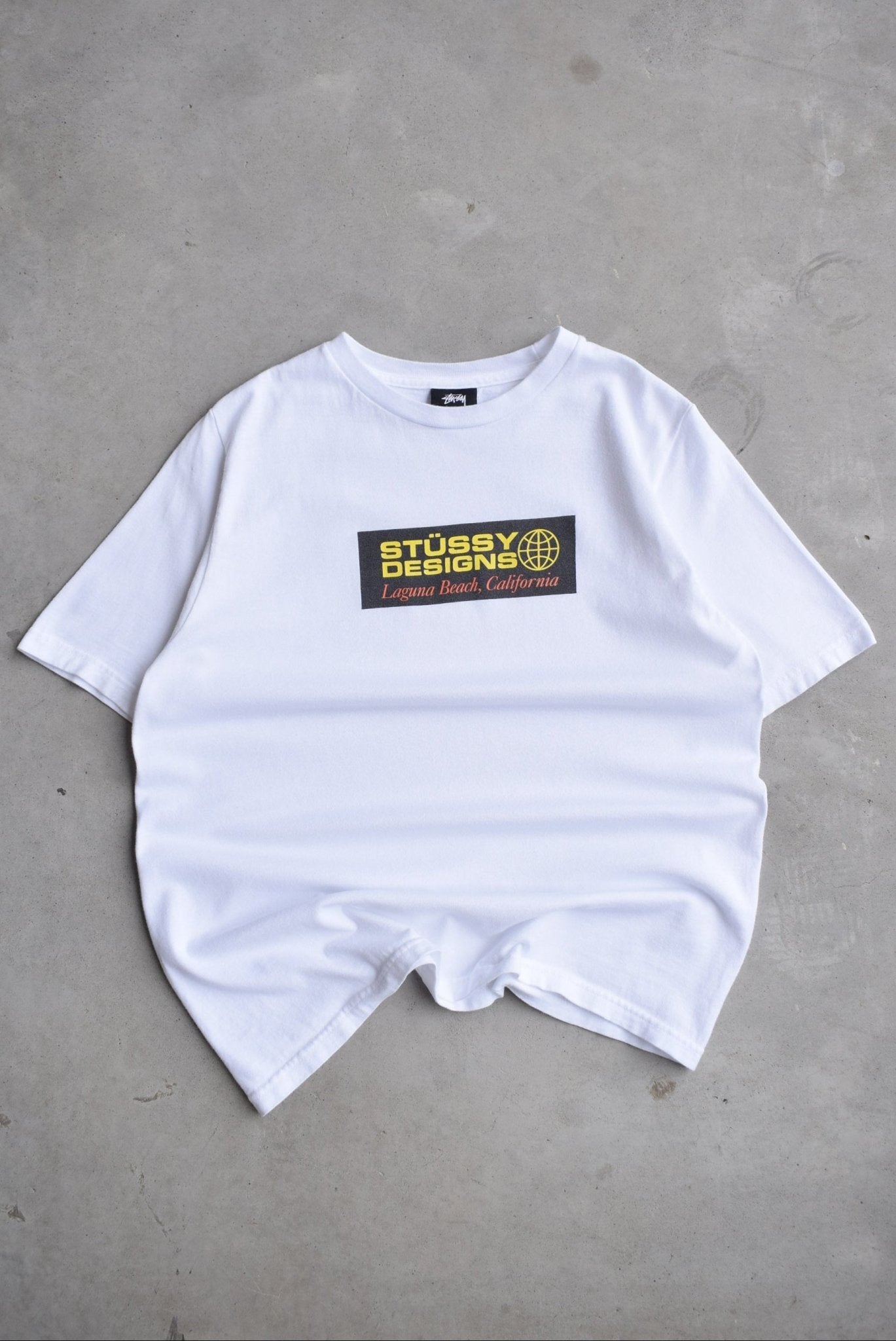 Stussy Designs White Graphic Tee — 2000s (S) - Retrospective Store
