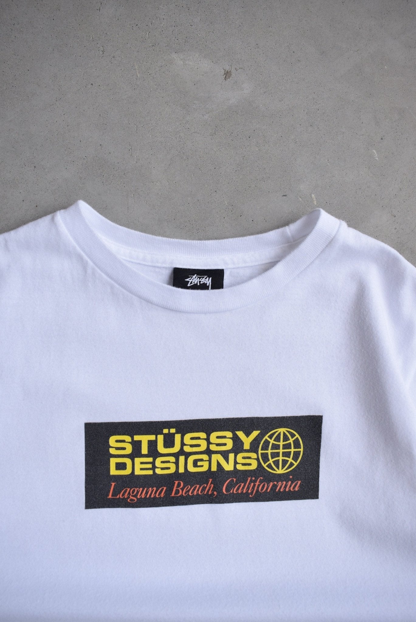 Stussy Designs White Graphic Tee — 2000s (S) - Retrospective Store