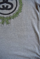 Stussy Grey Spellout Graphic Tee — 2000s (L) - Retrospective Store