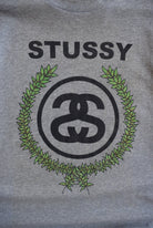 Stussy Grey Spellout Graphic Tee — 2000s (L) - Retrospective Store
