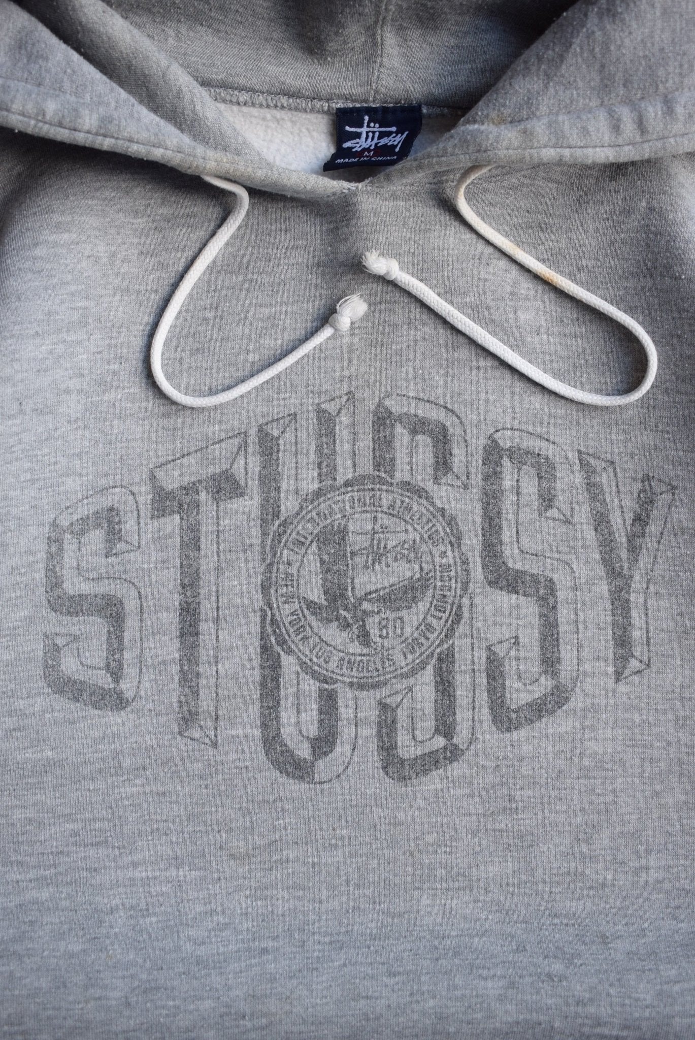 Stussy Grey Spellout Hoodie — 2000s (M/L) - Retrospective Store
