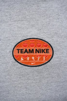 Team Nike Grey Spellout Tee — 1990s (L) - Retrospective Store